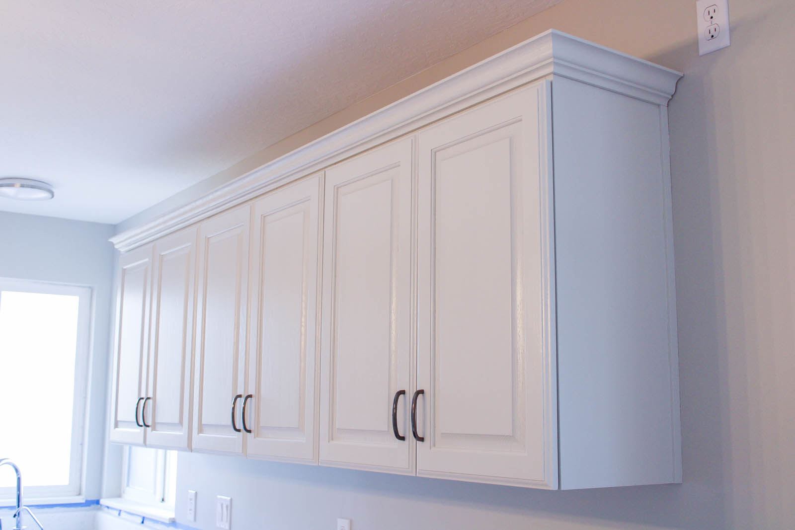 White cabinet doors with metal handles