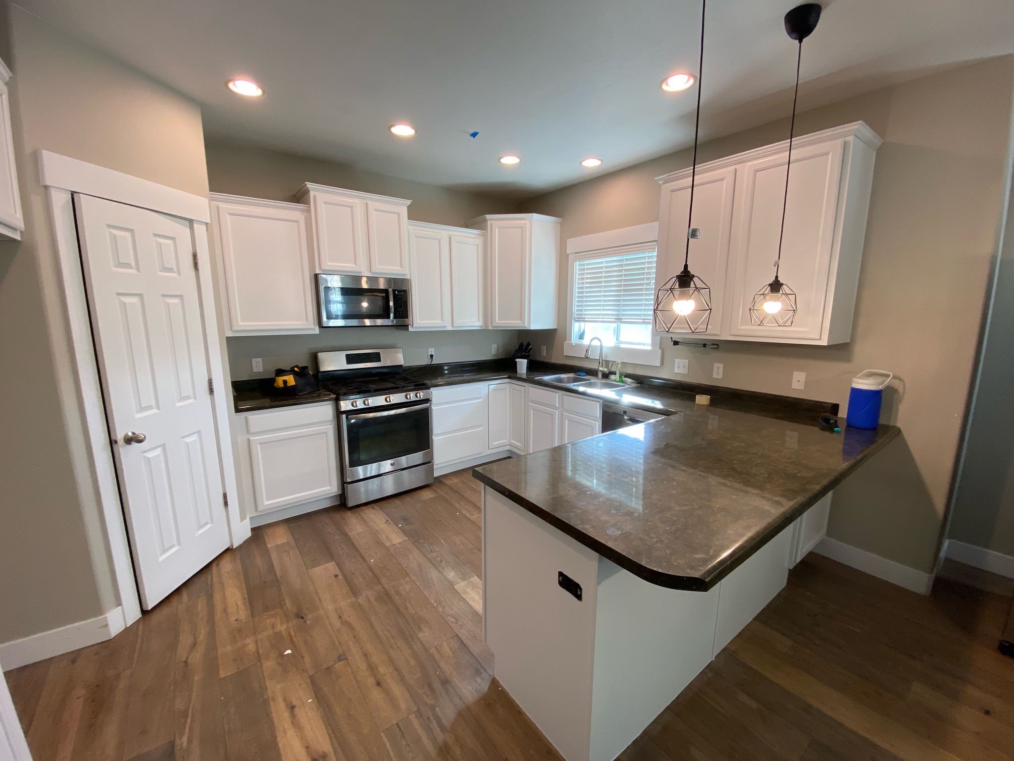 White cabinets and a central kitchen island