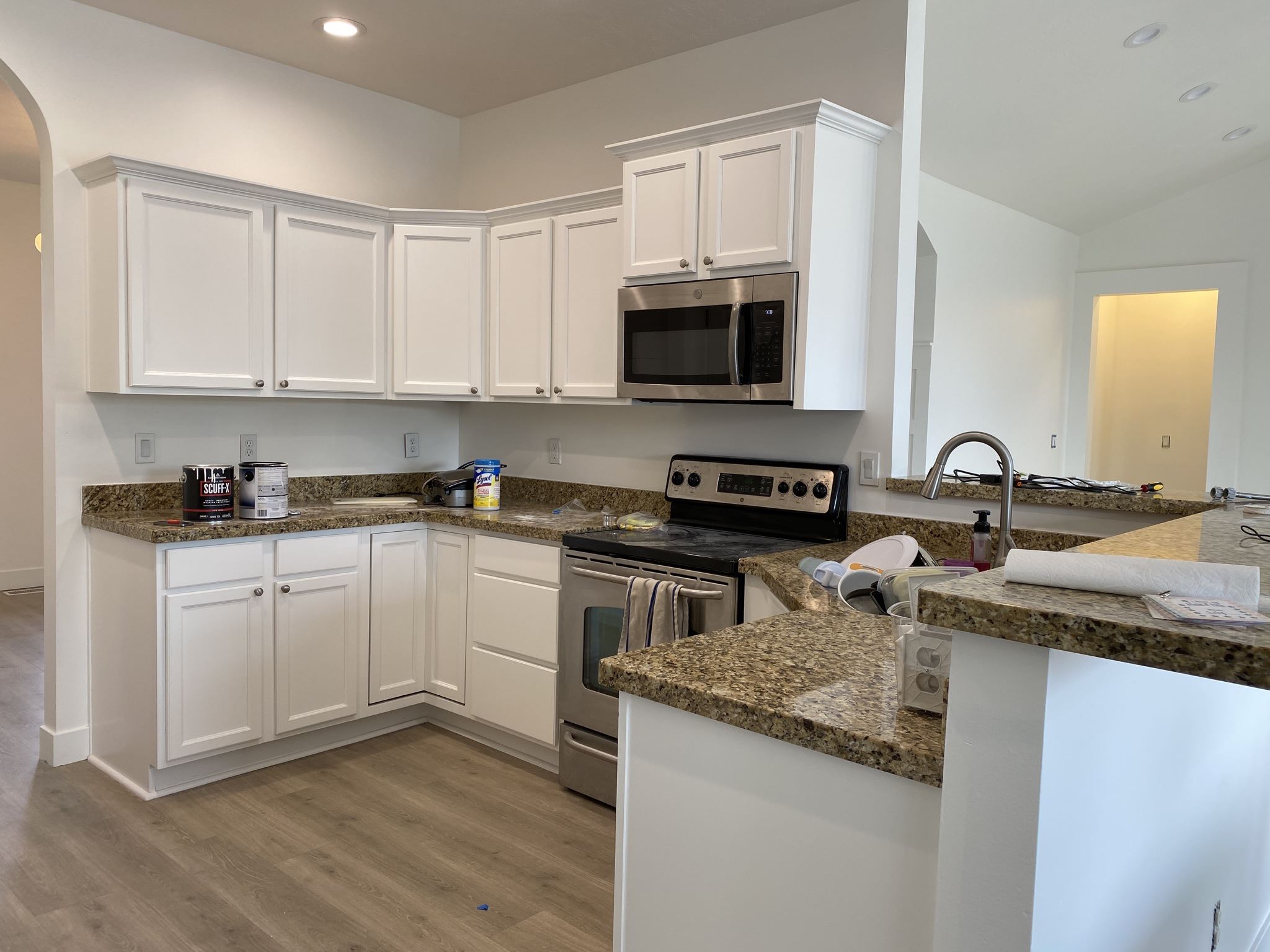White kitchen cabinets around a corner counter