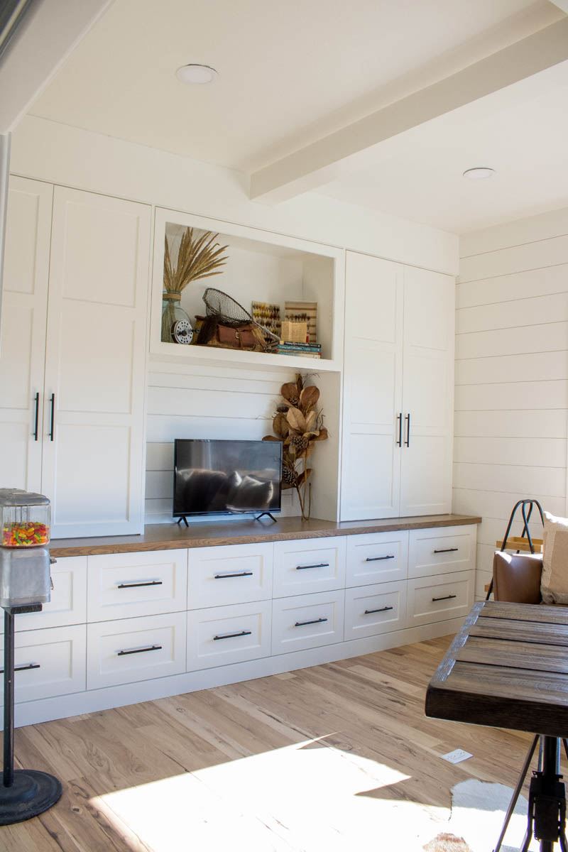 White kitchen drawers beside a sink
