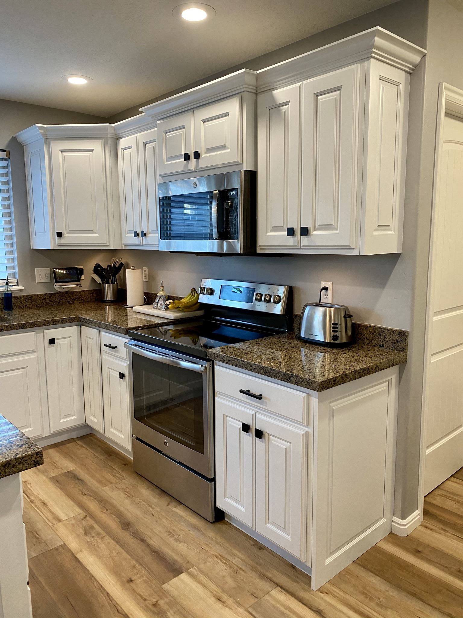 White kitchen island with decorative supports