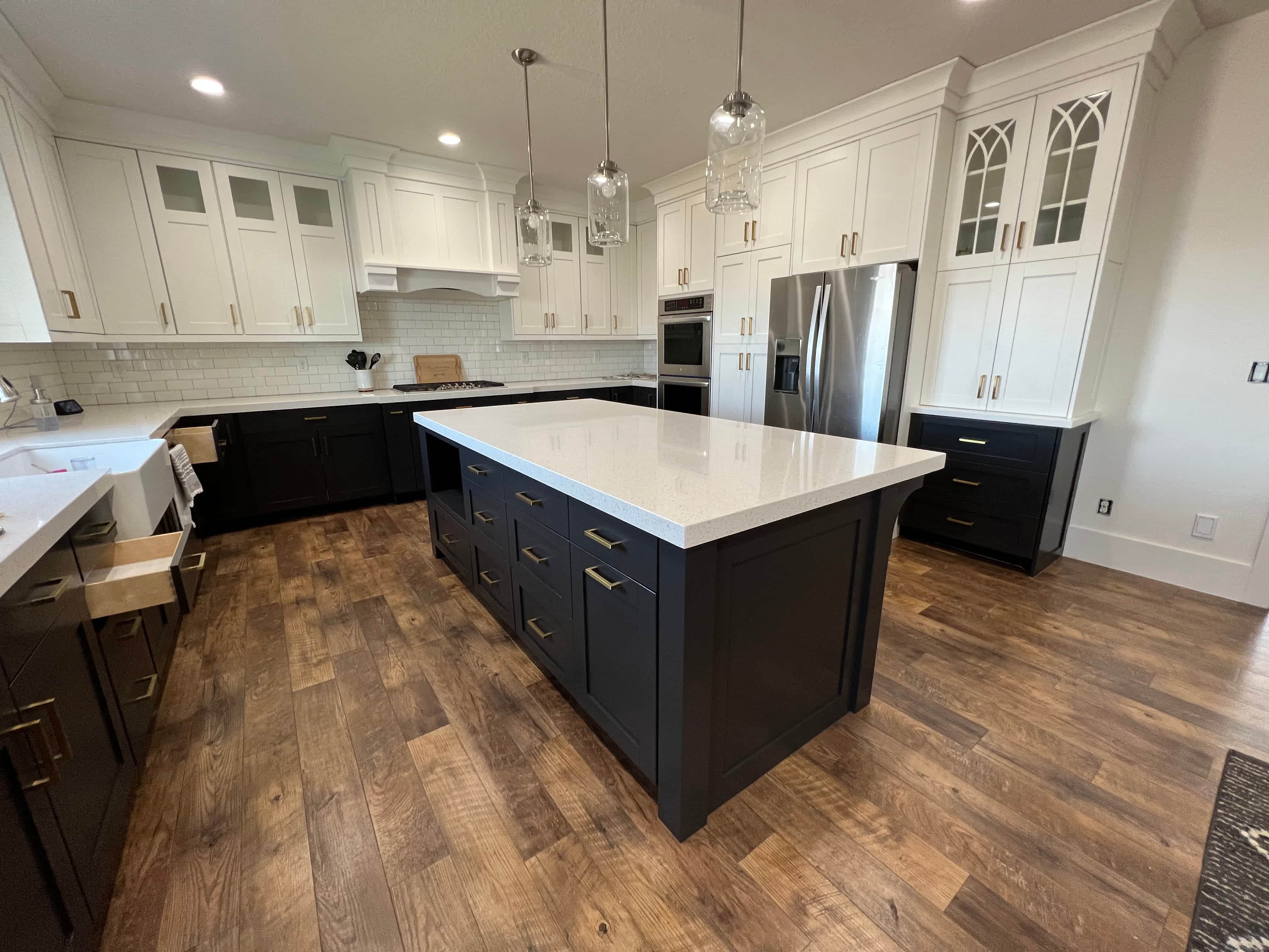 White perimeter cabinets with a dark island