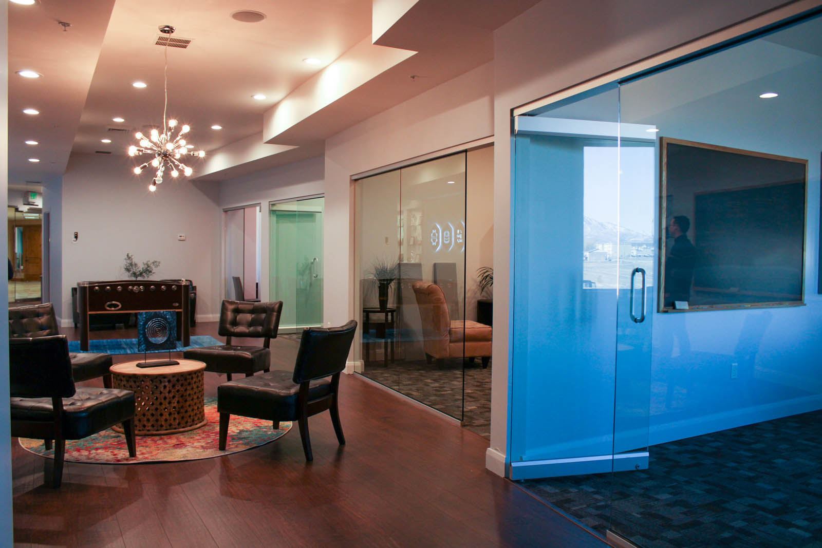 Teal commercial doors beside a seating area