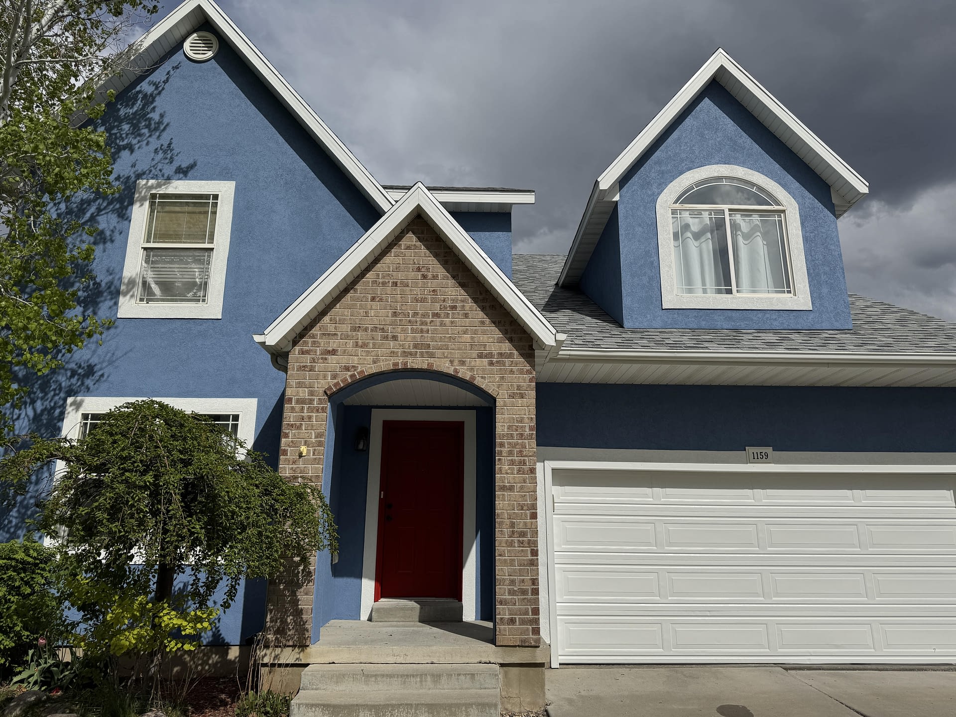Blue-gray house exterior with white trim