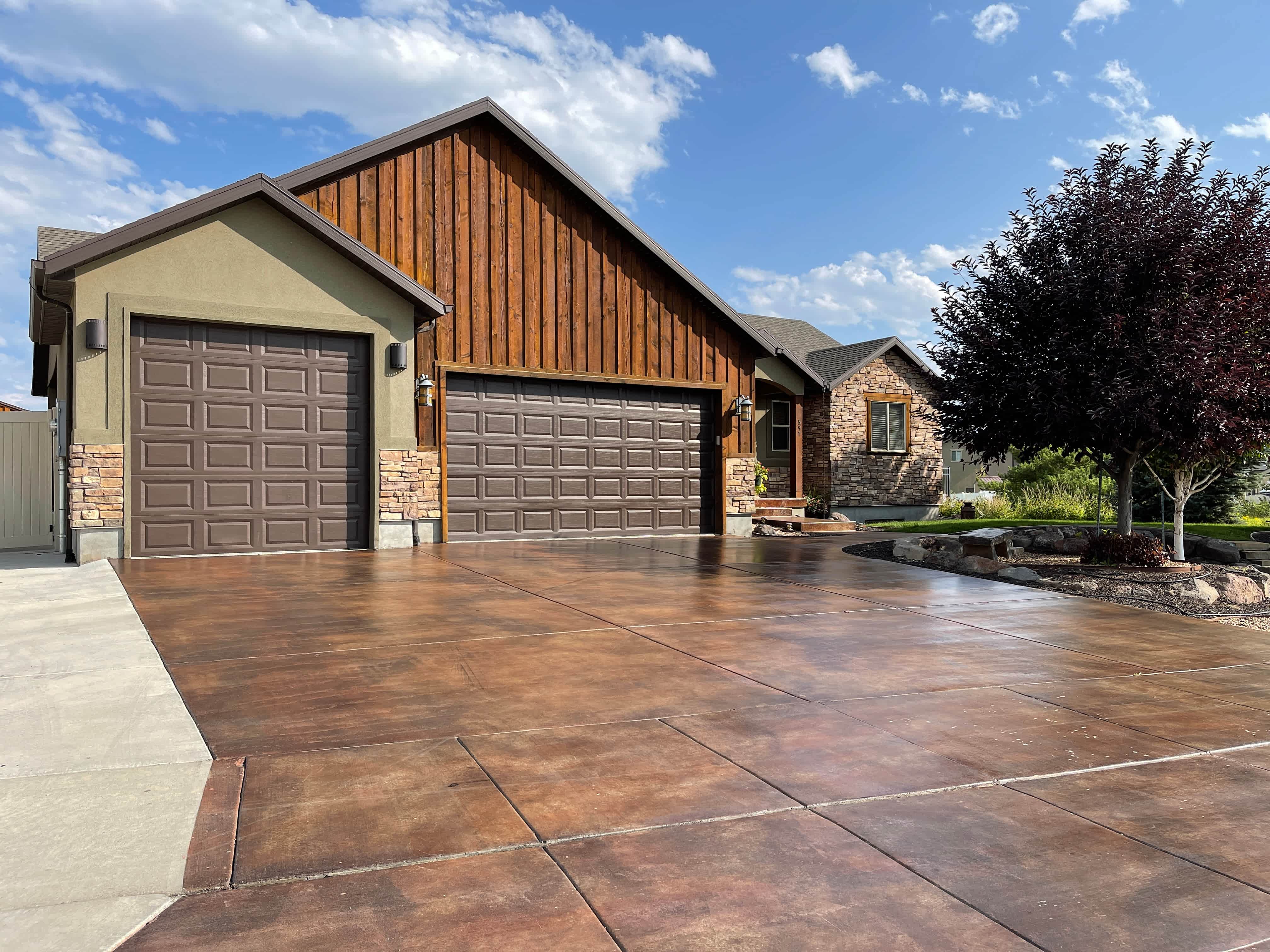 Brown detached garage with two vehicle doors