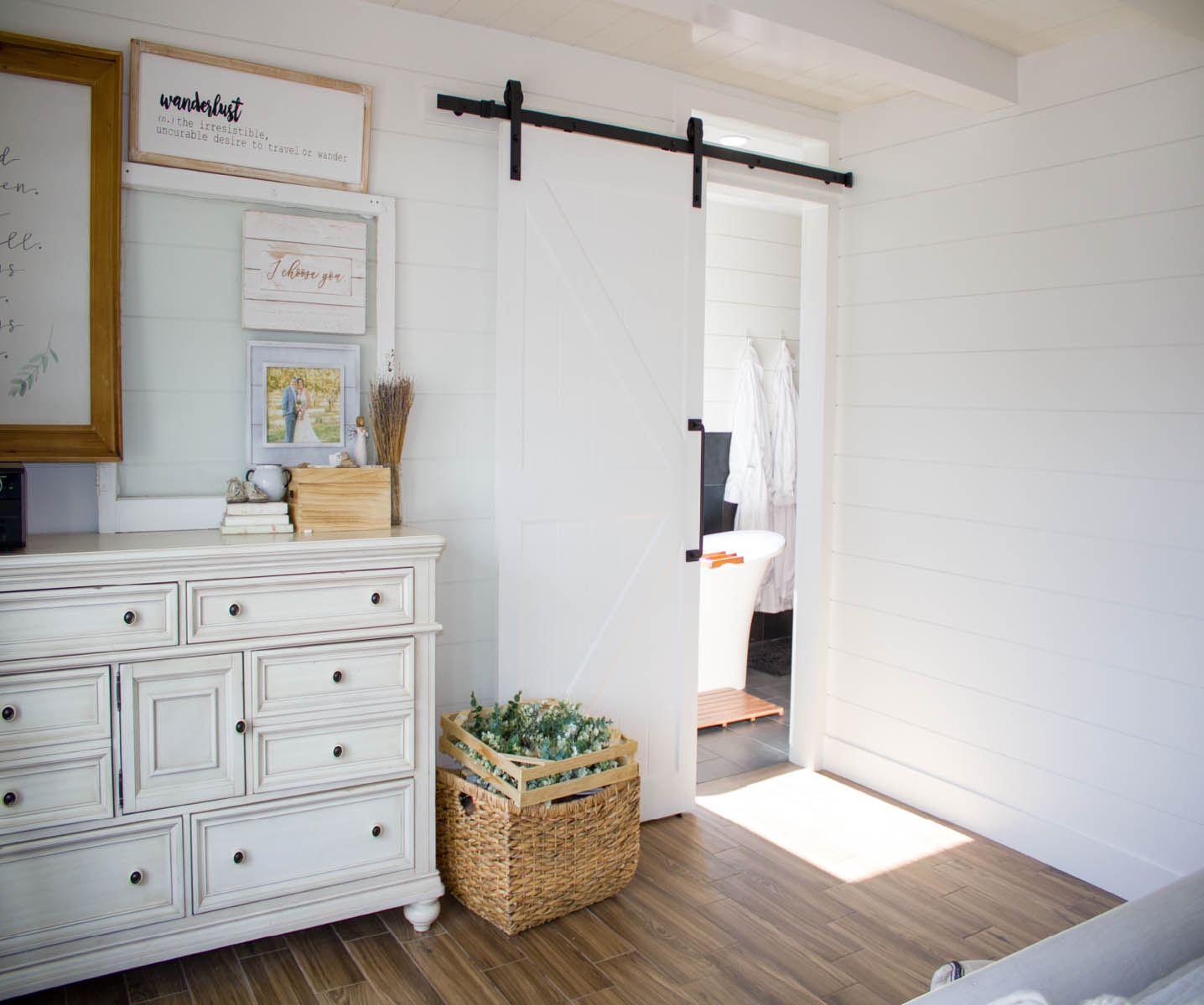 Bedroom with blue walls and white trim