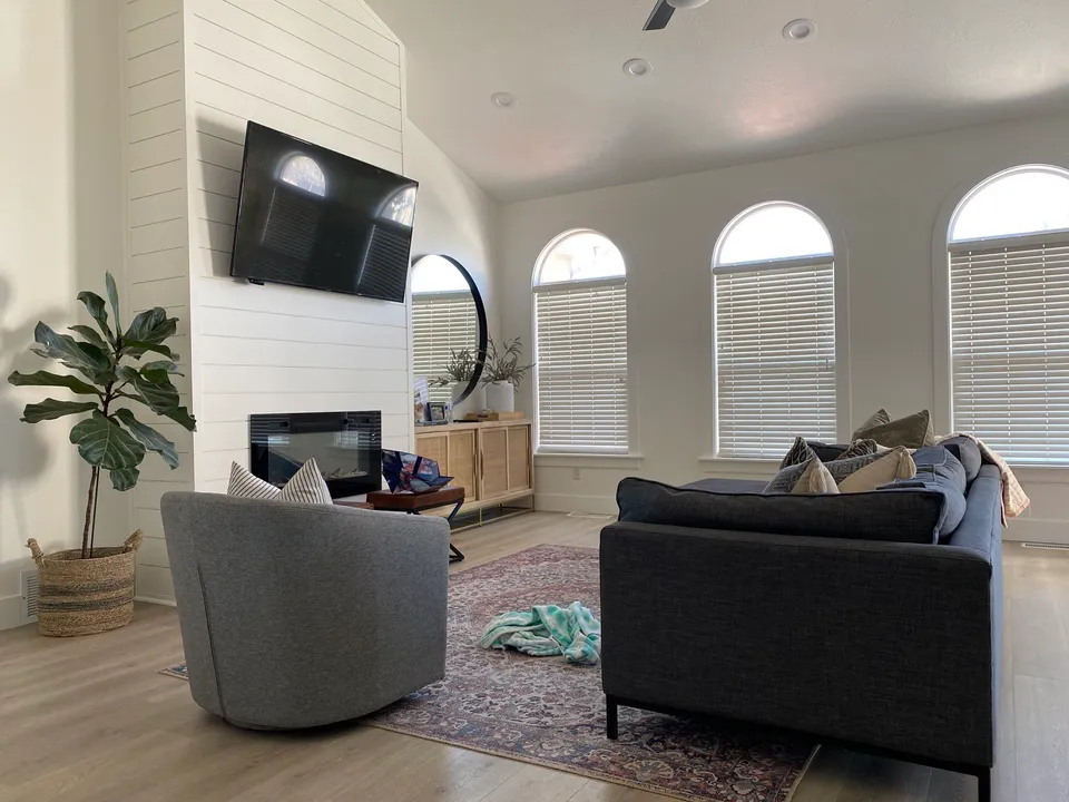 Living room with pale walls and dark fireplace