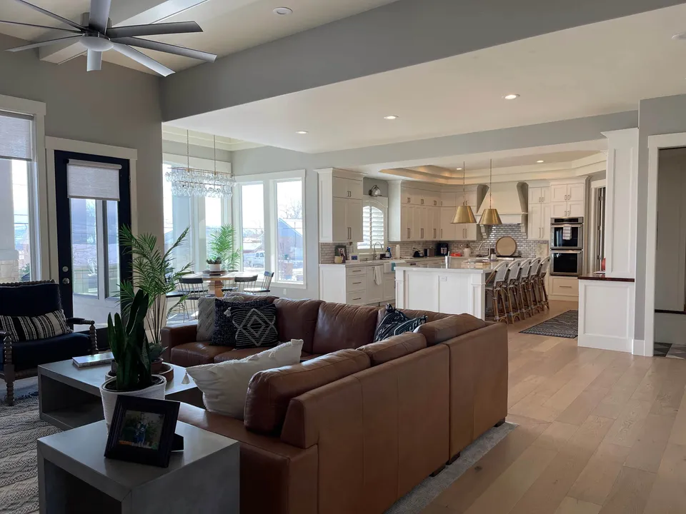 Open living room and kitchen with painted cabinetry